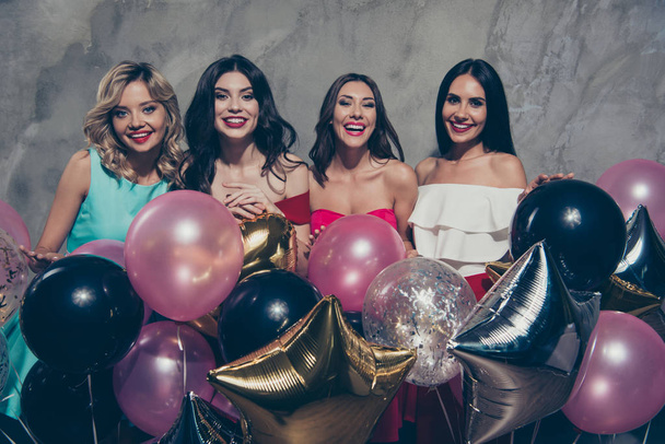 Portrait of nice-looking lovely chic elegant attractive glamorous gorgeous cheerful ladies many different shine baloons festive over gray concrete wall - Foto, afbeelding