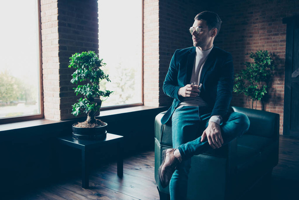 Portrait of his he nice handsome stylish trendy content luxury guy top manager director leader drinking beverage free time pause break at industrial loft interior workplace workspace - 写真・画像