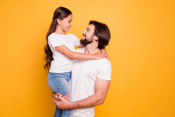 Portrait of her she his he nice tender cute sweet attractive cheerful people dad holding in hands pre-teen girl isolated over shine vivid pastel yellow background - Photo, Image