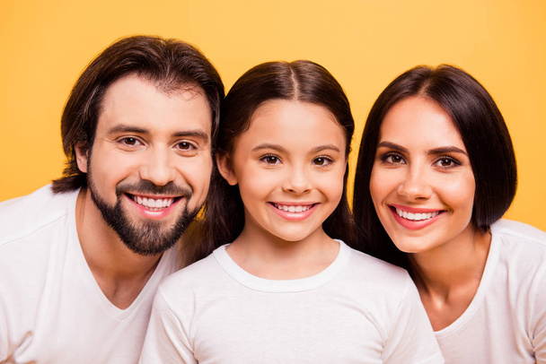 Close-up portrait of nice cute lovely winsome attractive charming cheerful people mommy daddy spending time pre-teen girl isolated over shine vivid pastel yellow background - Foto, Bild