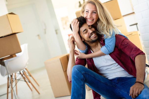 Happy couple after moving in to new home - 写真・画像