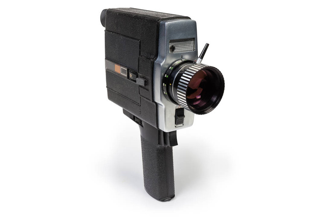 Vecchia cinepresa amatoriale formato Super 8mm guidata da motore elettrico su sfondo bianco
 - Foto, immagini