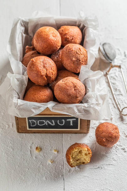 Tasty and homemade donuts balls with powdered sugar - Фото, изображение