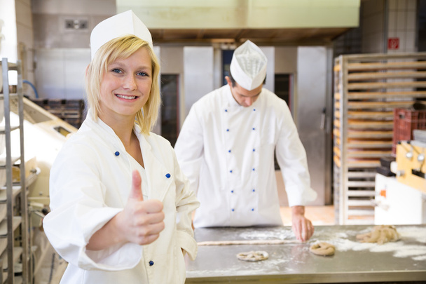 Baker posing in bakery or bakehouse - Photo, image