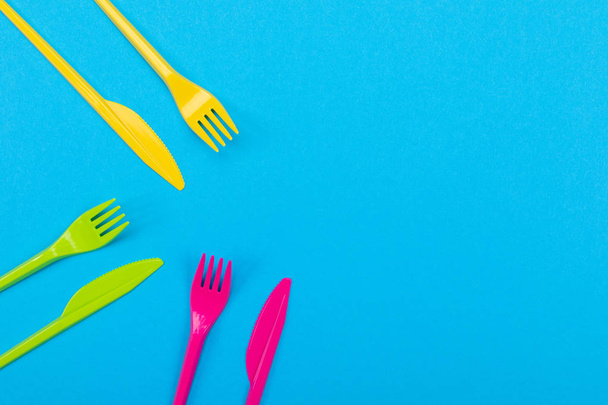 Colorful set of vibrant forks and knife isolated on black - Photo, Image