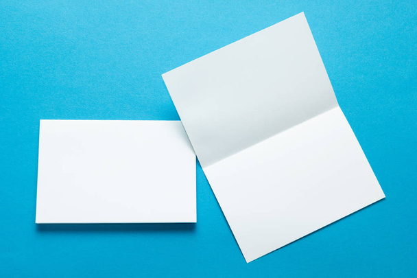 A layout for menus or brochures on a blue background. Two sheet brochures or greeting cards. Mock-up. - Foto, Bild