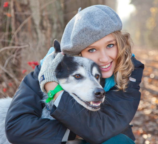 Portrait of a fresh and lovely woman with her dog. - Photo, Image
