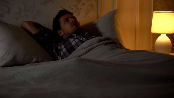 Male having insomnia, sleeping dysfunction, missing wife, family problems - Φωτογραφία, εικόνα
