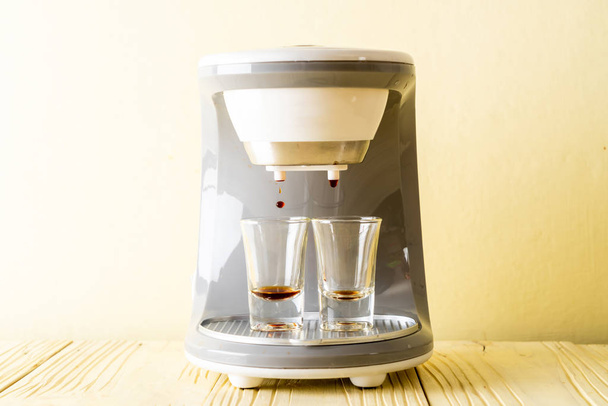 coffee maker machine making coffee on wood background - Valokuva, kuva