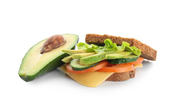 Tasty sandwich with avocado, vegetables and cheese on white background - Photo, image
