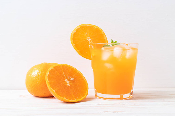 glass of orange juice with ice - Fotoğraf, Görsel
