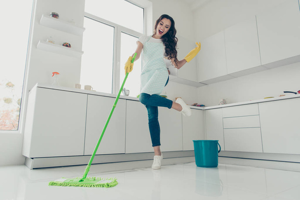 Full length body size side profile photo beautiful cheerful hardworking duties she her lady house love clean dancing singing wear jeans denim casual t-shirt covered cute apron bright light kitchen - Foto, Imagem