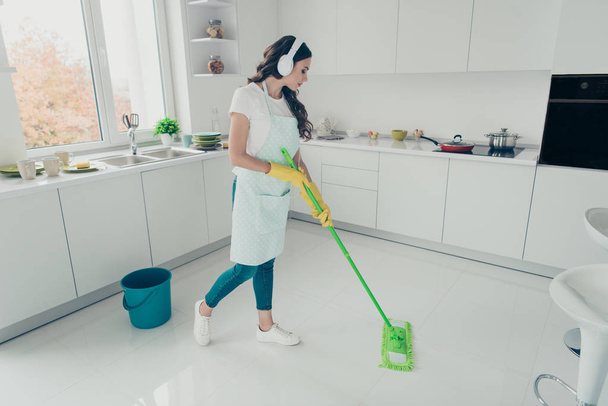 Full length body size portrait of her she nice beautiful wavy-haired house-wife using broom cleansing shine floor in modern light white interior indoors. - Fotografie, Obrázek