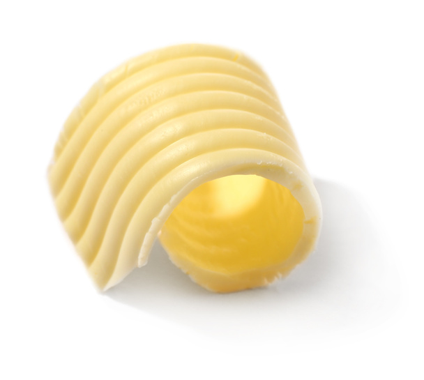 Curl de manteiga no fundo branco
 - Foto, Imagem