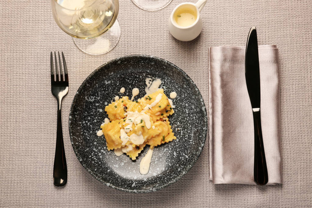 Plate with tasty ravioli on table - Photo, Image