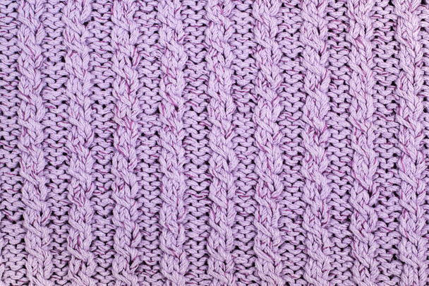 Sweater or scarf fabric texture large knitting. Knitted jersey background with a relief pattern. Braids in knitting . Wool hand- machine, handmade. - Photo, image