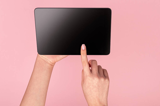 Woman tapping on screen of tablet  - Valokuva, kuva