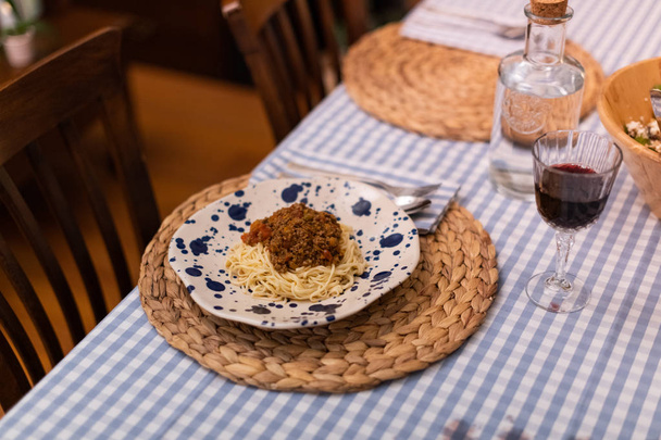 spaghetti bolognese served with wine - Photo, Image