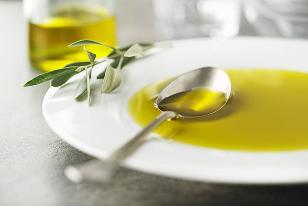 Healthy olive oil pouring with spoon close up-image concept - Foto, Imagem