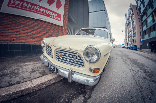 Helsinki, Finland - May 16, 2016: Old white Volvo Amazon car. distortion perspective fisheye lens view - Fotó, kép