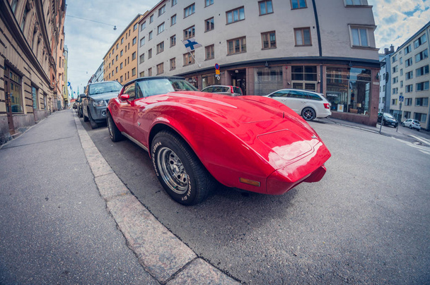 Helsinki, Finland - May 16, 2016: Old car red Chevrolet Corvette. distortion perspective fisheye lens view - Fotó, kép