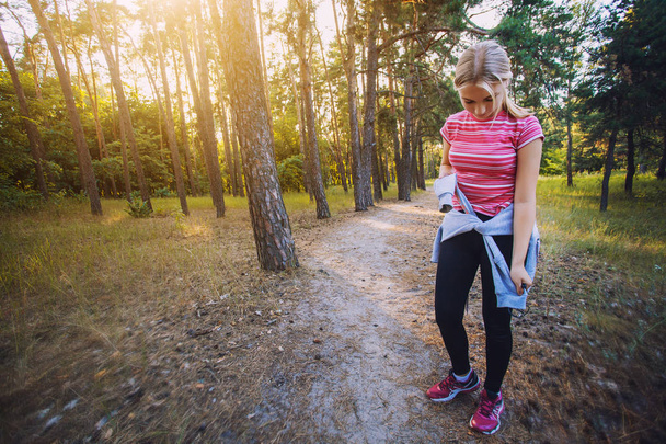 nice young girl on morning joging in a summer forest - Fotoğraf, Görsel