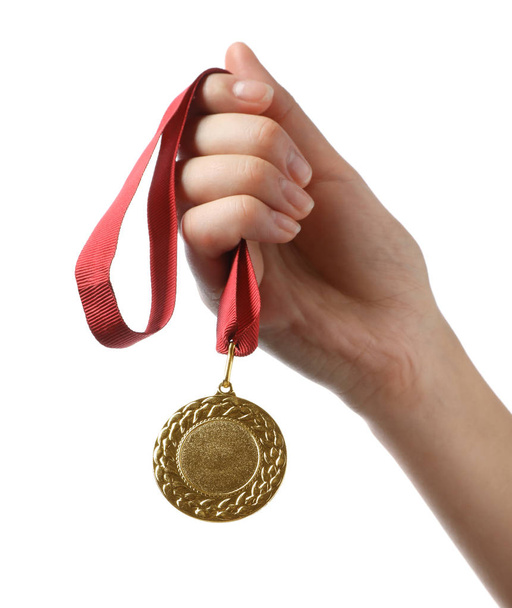 Woman holding gold medal with space for design on white background, closeup. Victory concept - Foto, Bild