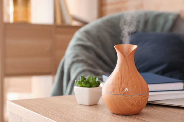 Aroma oil diffuser on table in room - 写真・画像
