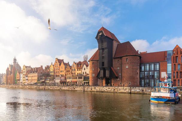 Zuraw Port Crane and the Motlawa embankment in Gdansk, sunny weather. - Photo, Image