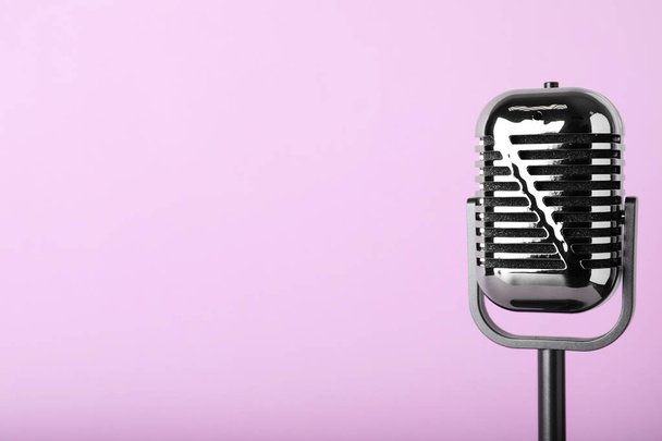 Retro microphone on color background, space for text - Φωτογραφία, εικόνα