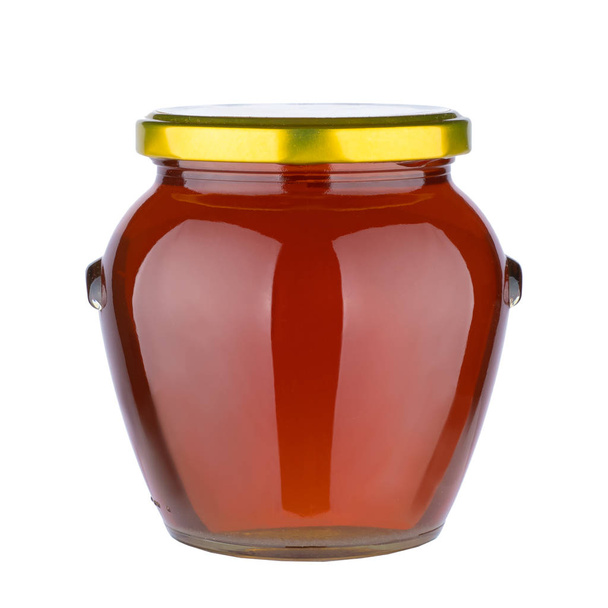 Смачний медовий горщик консервований, скляна банка, повна меду ізольована на білому тлі
. - Фото, зображення