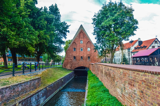 GDANSK, POLAND, SEPTEMBER 02 2018: Little canal flowing under an - Fotó, kép