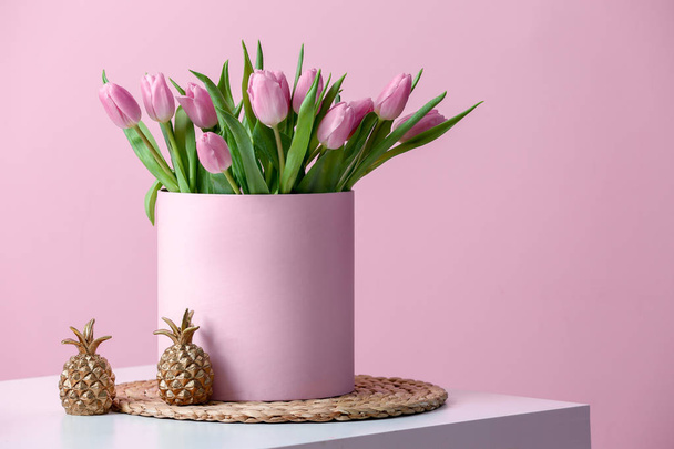 Box with bouquet of beautiful tulips on table - Φωτογραφία, εικόνα