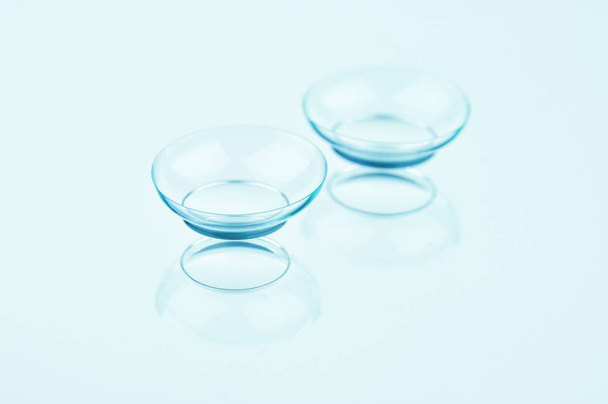 Contact lenses on a light background. Perfectly retouched contact lenses on a light blue background. - Foto, Imagem