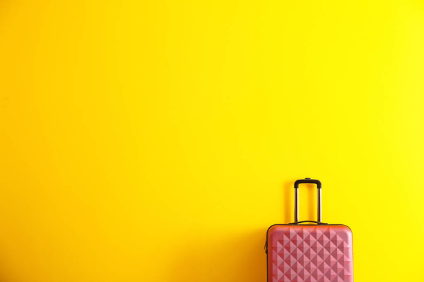 Packed suitcase on color background - Φωτογραφία, εικόνα