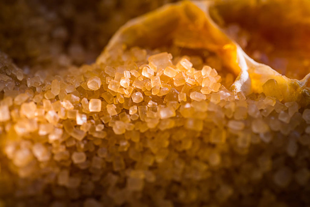 Brown sugar and thinly sliced dried orange - Foto, afbeelding