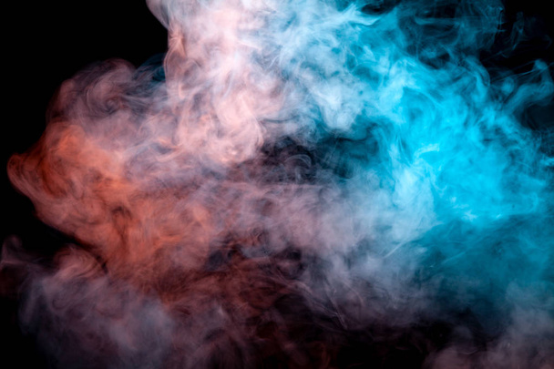 Background of orange, purple, red and blue wavy smoke on a black isolated ground. Abstract pattern of steam from vape of smoothly rising clubs. Mocap and print for t-shirt. - Φωτογραφία, εικόνα