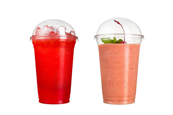 Delicious fruit smoothies in plastic cups, on a white background. Two cocktails with taste of berries and with taste of cherry. Isolated - 写真・画像