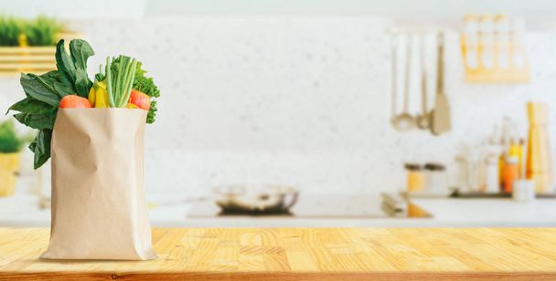 Wood table top on blurred kitchen background, - Fotó, kép