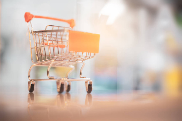Shopping concept. Close up blurry basket cart with bokeh light abstract background.  - Photo, Image