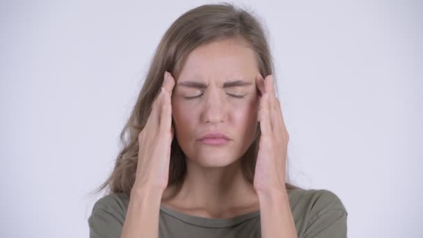Face of young stressed woman having headache - Felvétel, videó