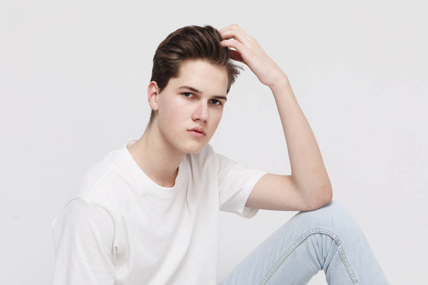 Young Male Model wearing white t-shirt - 写真・画像