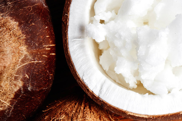 Vietnamese brown coconuts with coconut oil inside close up - Photo, Image