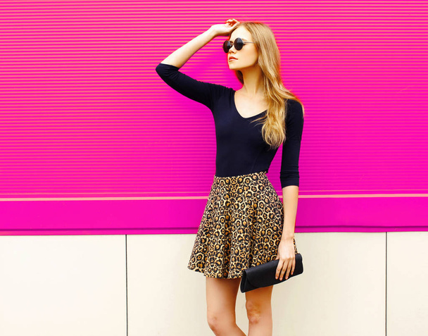 Portrait beautiful blonde woman model posing in leopard skirt, s - Фото, зображення
