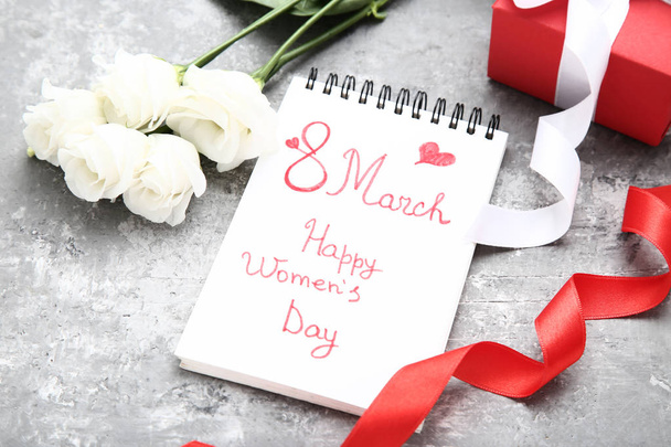 Text 8 March Happy Women's Day with eustoma flowers and gift box - Valokuva, kuva