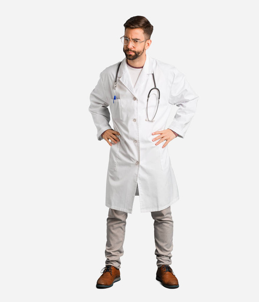 Young doctor man scolding someone very angry - Foto, Bild