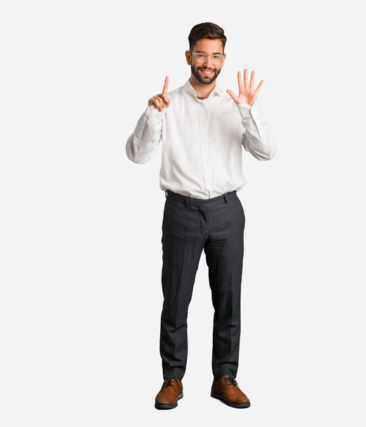 Young handsome business man showing number seven - Фото, зображення