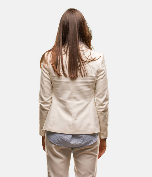 Caucasian business young woman from behind, looking back - Foto, imagen