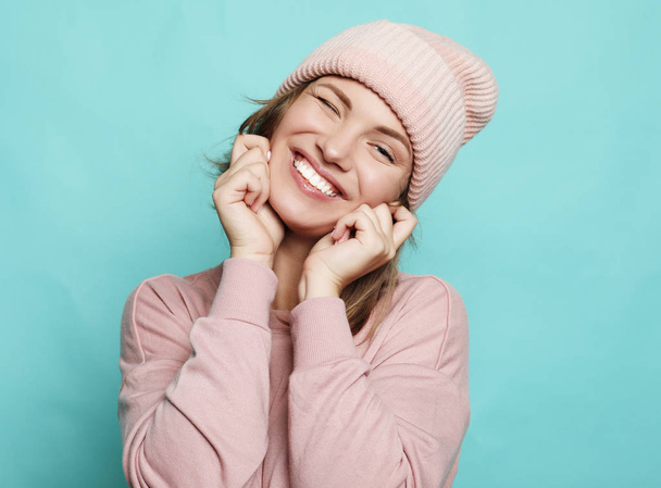 Image of happy young lady wearing pink hat and sweater  - Photo, image