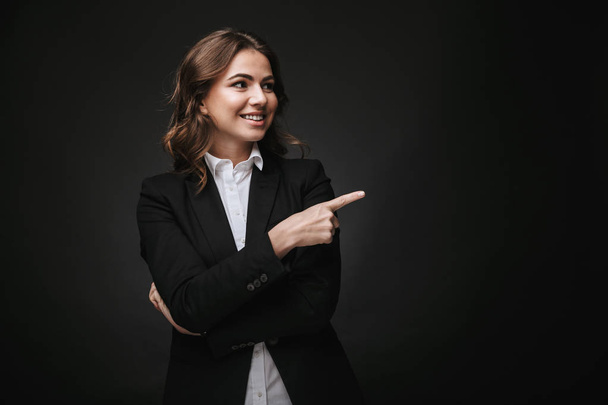Confident young businesswoman wearing a suit standing - Photo, Image